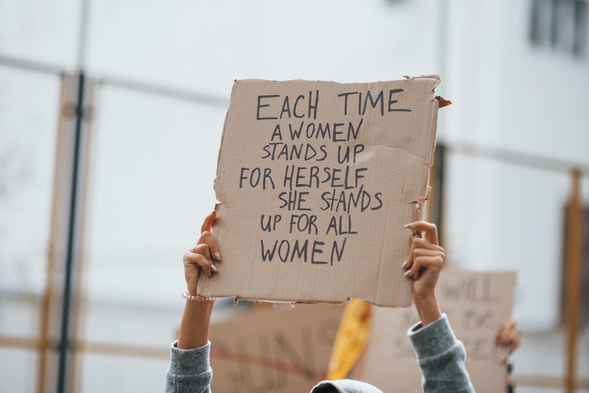 Demonstration is on action. Group of feminist women have protest for their rights outdoors